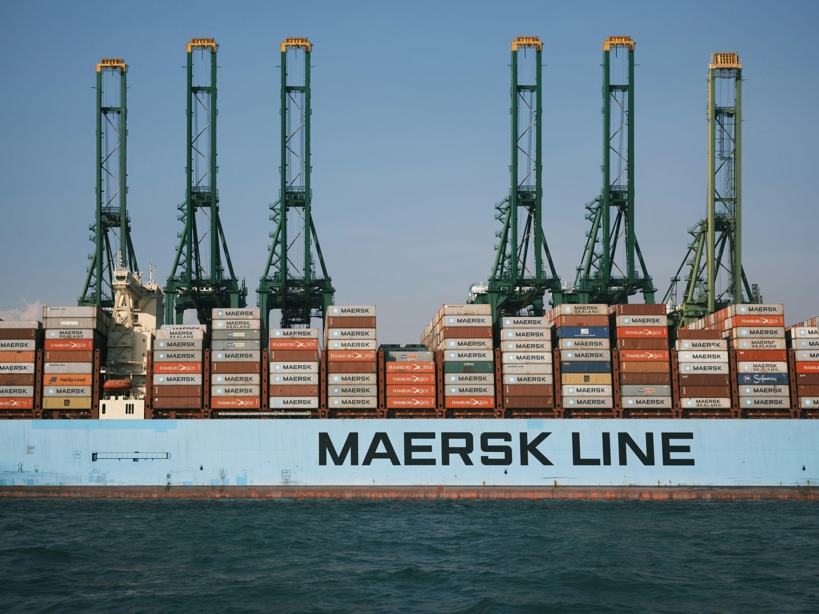 cargo ship on body of water during daytime